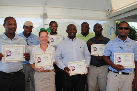 Eight supervisors at the Four Seasons Resort, Nevis showing off their graduation certificate from in-house training at the 10-week STEPS programme. (L-R front row) Stewarding Supervisor Mr. Cecil Dore, Front Office Supervisor Ms. Melanie Dupre, Safety and Loss Prevention Supervisor Mr. Livingston Brown, Audio Visual Supervisor Mr. Carl Tyson and Resort Landscaping Supervisor Mr. Kyle Mills. (L-R back row) Villa Landscaping Supervisor Mr. Alanzo David, Purchasing Supervisor Mr. Ignacio Ottley and Golf Course Supervisor Mr. Nigel Powell